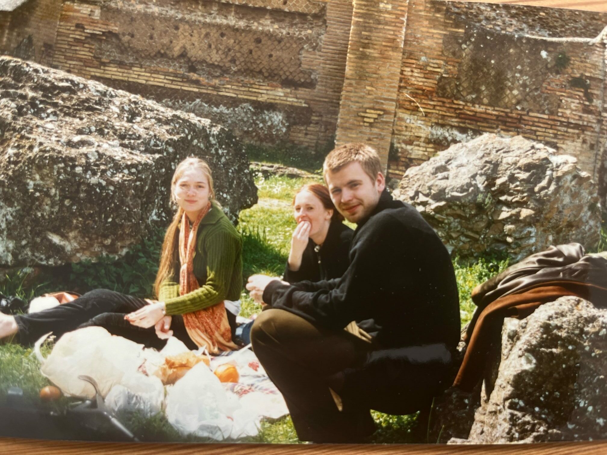 Three young men have a picnic