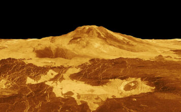 Bilete av overflata på Venus. Ho er oransje og ein kan sjå noko som liknar ein vulkan.